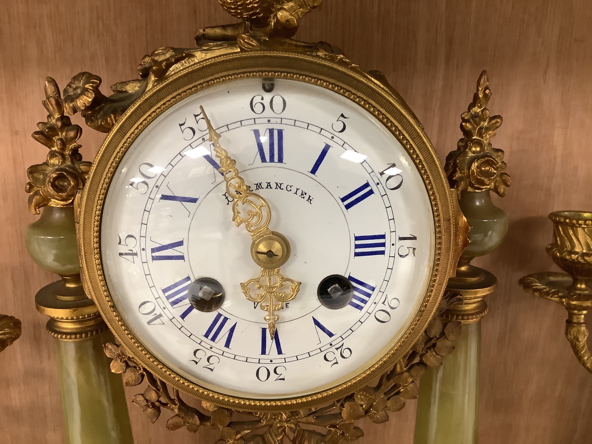 An ormolu and green onyx clock garniture